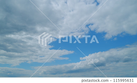 Puffy fluffy white clouds. Forming cloud moving with blue sunny, summer skies. Time lapse. Puffy fluffy white clouds. Forming cloud moving with blue sunny, summer skies. Time lapse. 115995631