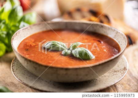 Healthy vegetarian tomato soup with parmesan and basil. Italian and Mediterranean food. Healthy vegetarian tomato soup with parmesan and basil. Italian and Mediterranean food. 115995973