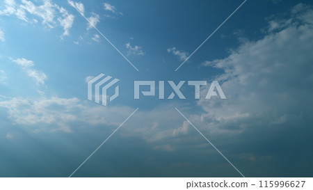 Fluffy layered clouds sky atmosphere. Majestic amazing blue sky with clouds. White and blue colors. Time lapse. 115996627