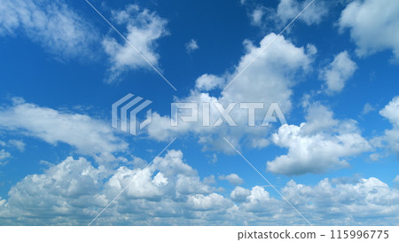 Dramatic majestic amazing blue sky. Puffy fluffy white clouds. Time lapse. 115996775