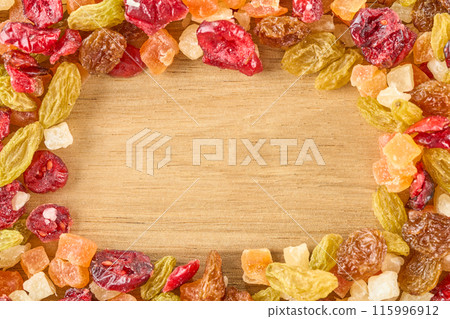 Assorted dried fruits on a wooden board Assorted dried fruits on a wooden board 115996912