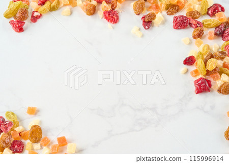 Assorted dried fruits on a wooden board 115996914