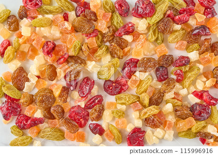 Assorted dried fruits on a wooden board Assorted dried fruits on a wooden board 115996916