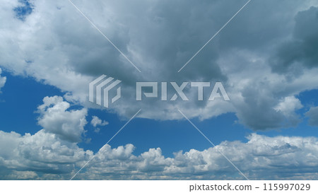 Dramatic stormy dark and light cumulus clouds before rain, blue sky white clouds. Timelapse. Dramatic stormy dark and light cumulus clouds before rain, blue sky white clouds. Timelapse. 115997029
