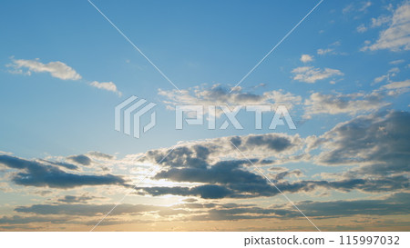 Beautiful epic scenic clouds rolling over sky background backlit by sunset. Horizon, beautiful view landscape. Timelapse. 115997032