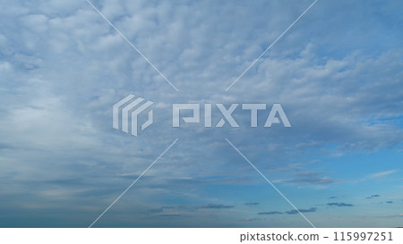 Fluffy layered clouds sky atmosphere. Puffy fluffy white clouds. Formation cloud sky scape. Timelapse. Fluffy layered clouds sky atmosphere. Puffy fluffy white clouds. Formation cloud sky scape. Timelapse. 115997251