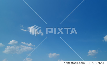 Blue sky with copyspace background with forming clouds in summer day outdoors. Timelapse. Blue sky with copyspace background with forming clouds in summer day outdoors. Timelapse. 115997651