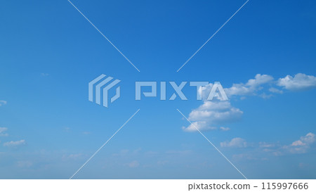 Summer blue sky and white clouds background. Layers of cloud space. Blue sky fluffy white clouds on summer season. Timelapse. 115997666