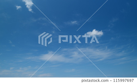 Cirrus clouds flying slowly on beautiful blue sky horizon background. Timelapse. Cirrus clouds flying slowly on beautiful blue sky horizon background. Timelapse. 115997697