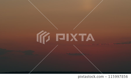 Evening sky at sunset in different shades. Beautiful romantic and colorful sky with brightly gradient color. Timelapse. 115997856