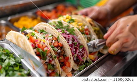 A close-up of cooking gourmet tacos 116000262