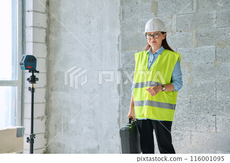 Portrait of female industrial worker builder engineer supervisor at construction 116001095