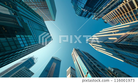Upward perspective of modern skyscrapers with blue sky background, highlighting business growth and corporate architecture. 116001973