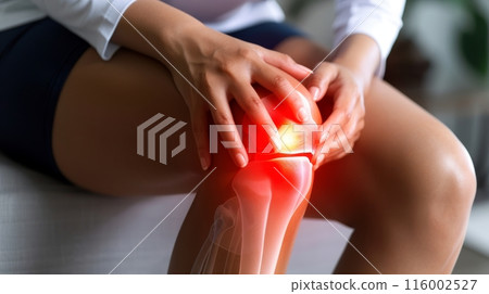 A woman is shown sitting with her hands on her knee 116002527