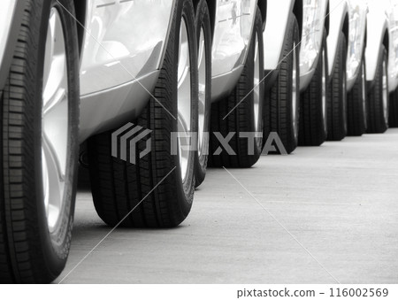 Line of the wheels of same vehicles staying on the road Line of the wheels of same vehicles staying on the road 116002569
