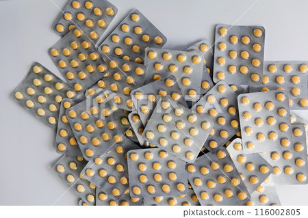 A lot of yellow pills packs. Pharmaceutical medicine pills. A lot of yellow pills packs. Pharmaceutical medicine pills. 116002805