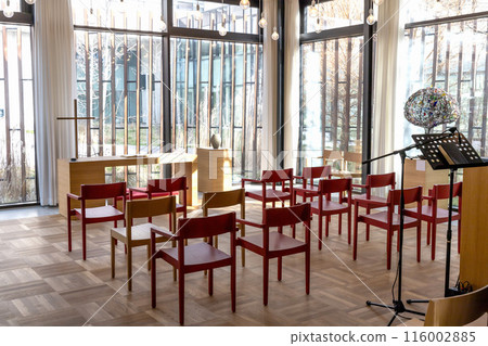 Church room for prayer and privacy with a large cross and chairs for visitors. 116002885