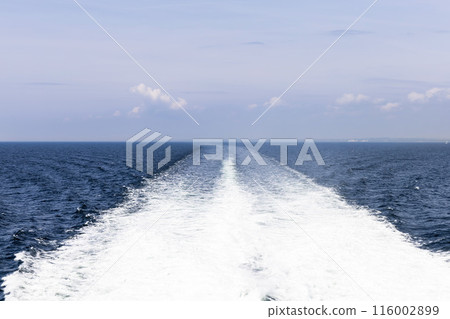 Water trail behind cruise ship. Summer travel concept. 116002899