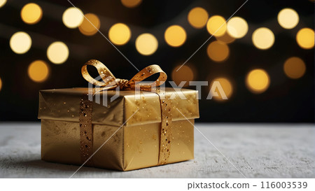 golden gift box with a sparkling ribbon sits on... - Stock Illustration ...