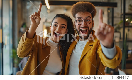 A man and a woman stand next to each other and smile. They look extremely amazed, happy and satisfied and show a thumbs up gesture. A man and a woman stand next to each other and smile. They look extremely amazed, happy and satisfied and show a thumbs up gesture. 116004467
