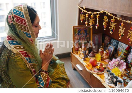 Indian Woman Praying At Altar Indian Woman Praying At Altar 116004670