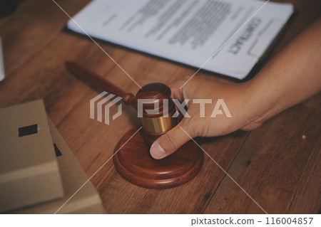 Judge gavel with Justice lawyers having team meeting at law firm background. Concepts of Law and Legal services. Judge gavel with Justice lawyers having team meeting at law firm background. Concepts of Law and Legal services. 116004857