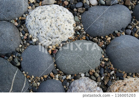 Background of smooth flat pebbles and gravel. Pebbles of different shapes and colors. Background of smooth flat pebbles and gravel. Pebbles of different shapes and colors. 116005203
