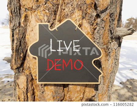 Live demo symbol. Concept words Live demo on beautiful black house blackboard. Beautiful tree background. Copy space. Business and live demo concept. Live demo symbol. Concept words Live demo on beautiful black house blackboard. Beautiful tree background. Copy space. Business and live demo concept. 116005282