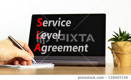 SLA service level agreement symbol. Concept words SLA service level agreement on beautiful black tablet. Beautiful white background. Business SLA service level agreement concept. Copy space. SLA service level agreement symbol. Concept words SLA service level agreement on beautiful black tablet. Beautiful white background. Business SLA service level agreement concept. Copy space. 116005336