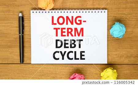 Long-term debt cycle symbol. Concept words Long-term debt cycle on beautiful white note. Beautiful wooden table background. Colored paper. Black pen. Business Long-term debt cycle concept. Copy space. 116005342