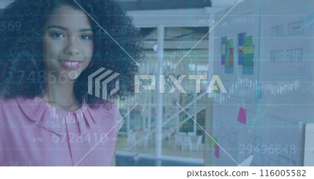 Image of financial data processing over biracial businesswoman in office Image of financial data processing over biracial businesswoman in office 116005582