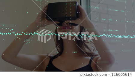 Image of financial data processing over caucasian woman using vr headset 116005614