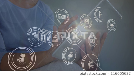 Image of icons in circles over midsection of caucasian woman using digital tablet at home Image of icons in circles over midsection of caucasian woman using digital tablet at home 116005622