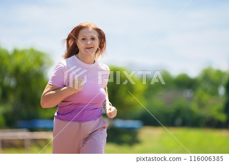 Elderly woman exercising. Fit senior lady running. Elderly woman exercising. Fit senior lady running. 116006385