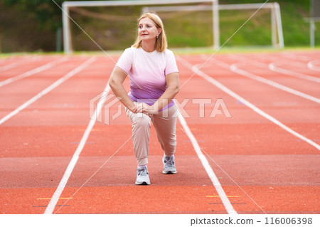 Elderly woman exercising. Fit senior lady running. Elderly woman exercising. Fit senior lady running. 116006398