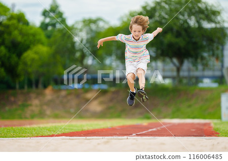 Kids long jump athletics training. Child jumping. Kids long jump athletics training. Child jumping. 116006485