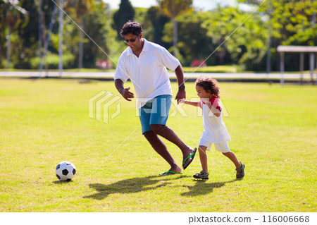 Father and son play football. Young active family. 116006668