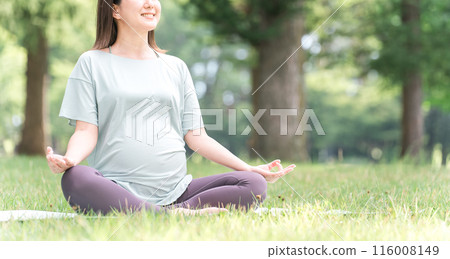 Young Asian woman doing maternity yoga, pre-mom yoga, pilates in forest/park (meditation, deep breathing) Young Asian woman doing maternity yoga, pre-mom yoga, pilates in forest/park (meditation, deep breathing) 116008149