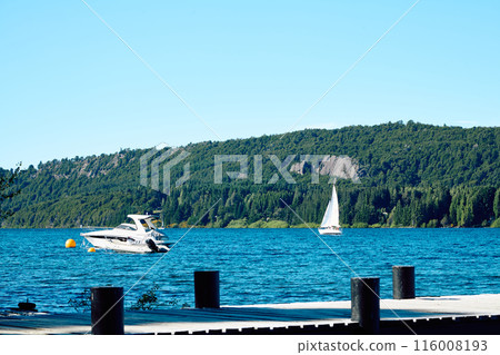 Beautiful mountain lake. Transparent blue water. Shore pier. Beautiful mountain lake. Transparent blue water. Shore pier. 116008193