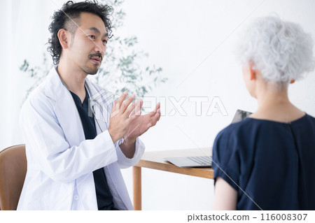 Doctor examining elderly patient: Close-up image of medical and psychiatric interview, examination, and counseling Doctor examining elderly patient: Close-up image of medical and psychiatric interview, examination, and counseling 116008307
