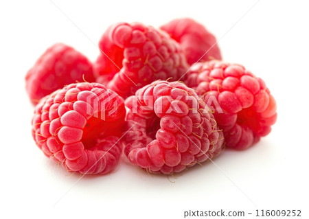 Ripe raspberries isolated on a white background Ripe raspberries isolated on a white background 116009252