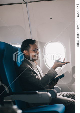 Airplane, travel and portrait of businessman working on laptop computer and smartphone while sitting in airplane. 116009861
