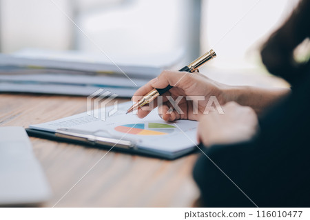 Cheerful business lady working on laptop in office, Asian happy beautiful businesswoman in formal suit work in workplace. Attractive female employee office worker smile. 116010477