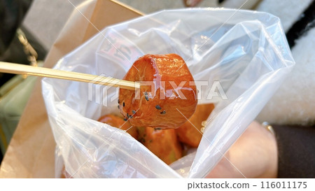 Eating sweet potato on the go 116011175