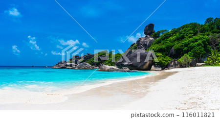 Panorama landscape beautiful view with blue sky and clouds, blue sea and white sand beach on Similan island, No.8 at Similan national park, Phuket, Thailand is most popular vacation for tourist. Panorama landscape beautiful view with blue sky and clouds, blue sea and white sand beach on Similan island, No.8 at Similan national park, Phuket, Thailand is most popular vacation for tourist. 116011821