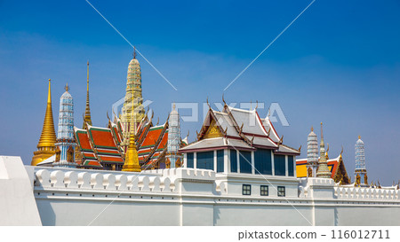 Temple Wat Phra Kaew is in the Royal Palace of Bangkok, Thailand. It is a popular place and destination for tourists around the world. 116012711