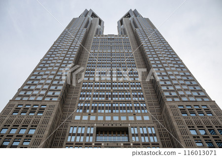 A modern high-rise building with a simple design of square bars is separated from the background. 116013071