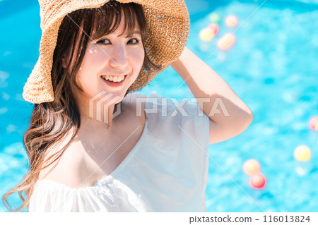 Young Asian woman in resort fashion by the pool at a resort (vacation, travel) Young Asian woman in resort fashion by the pool at a resort (vacation, travel) 116013824