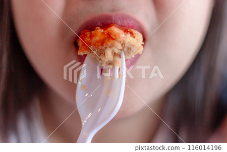 Woman eating fried chicken blur background, Street food thailand 116014196