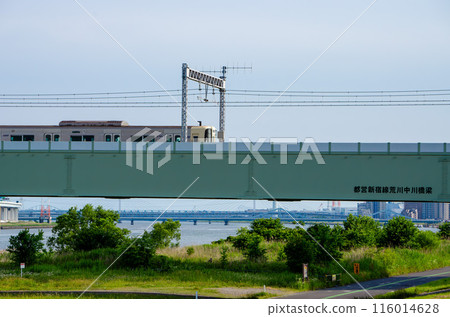 Keio Electric Railway train running on the Arakawa-Nakagawa Bridge on the Toei Shinjuku Line Keio Electric Railway train running on the Arakawa-Nakagawa Bridge on the Toei Shinjuku Line 116014628